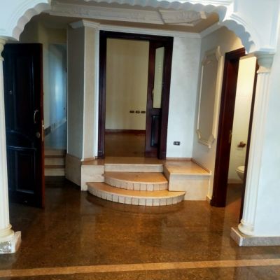 A fully furnished, unfurnished apartment is available for rent, suitable for residential use only. It includes a kitchen and is located in one of the most prestigious areas of New Cairo, 