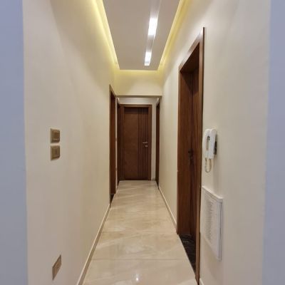 Unfurnished apartment for rent with kitchen and water heaters in North Lotus - Fifth Settlement