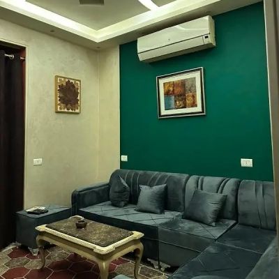 Unfurnished apartment for rent with kitchen and air conditioning (residential and commercial use) in Al Banafseg 7 Villas, First Settlement.